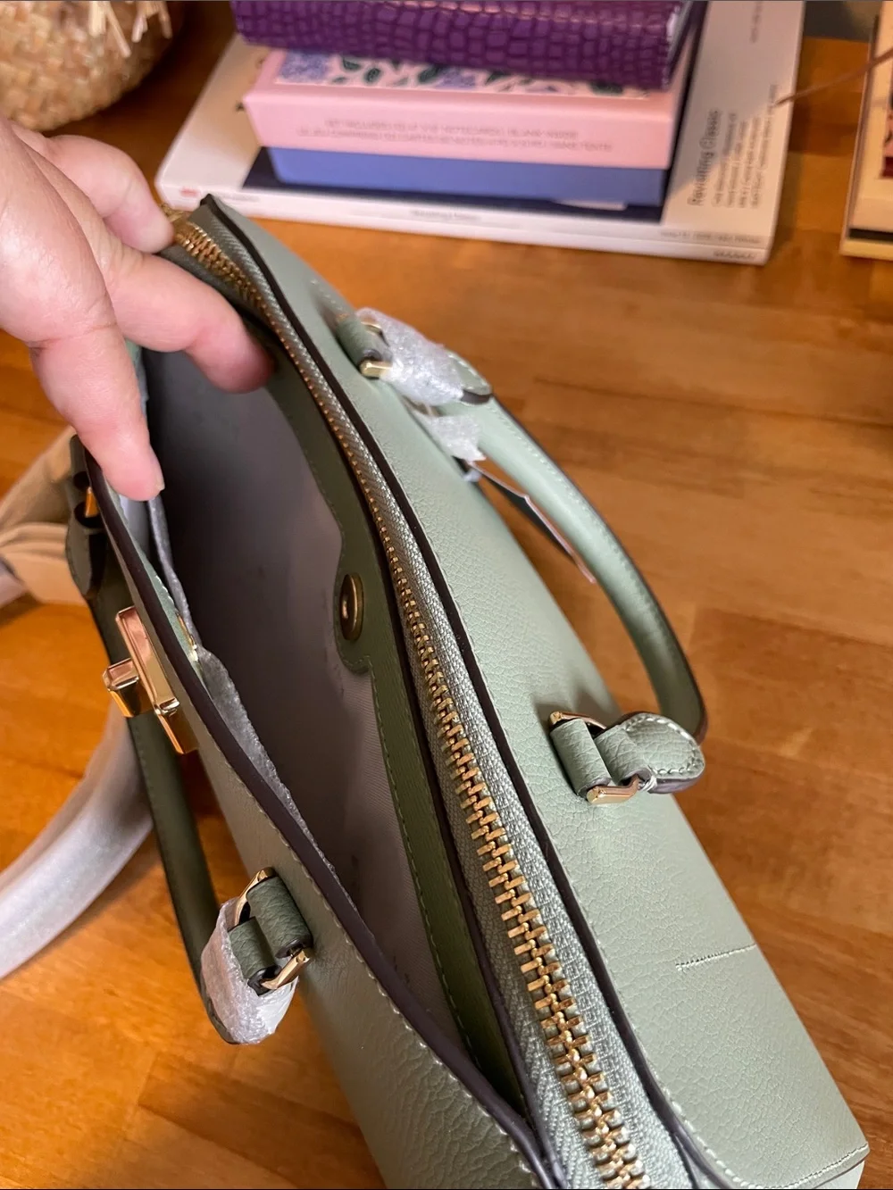 The Kate Spade KK114 refers specifically to the Phoebe East West Satchel